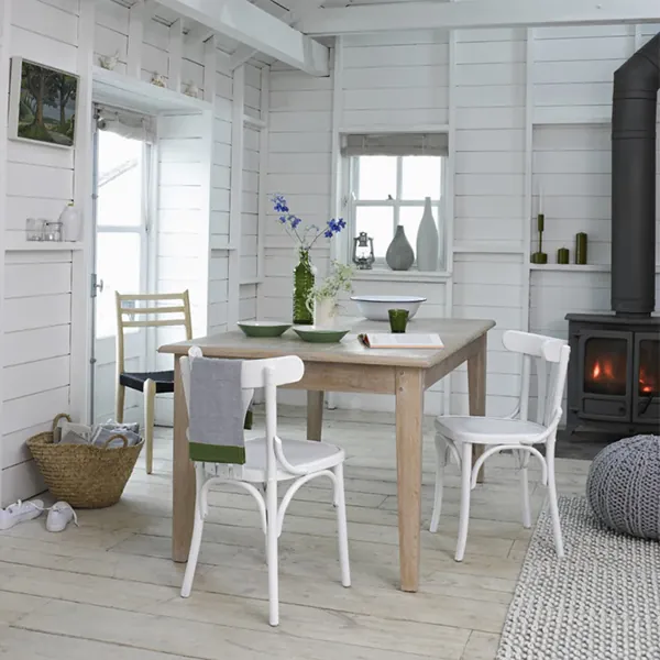 White wooden chairs made for dining spaces